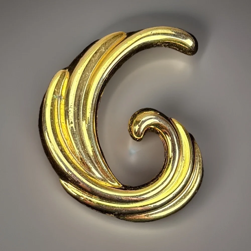 Vintage Goldtone Weighted Swirl Brooch